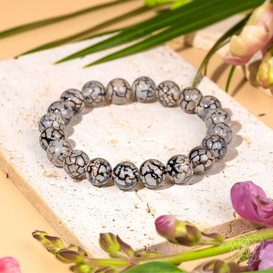 River agate bracelet from Conscious Items featuring smooth, polished stones with natural patterns, perfect for calming your style.