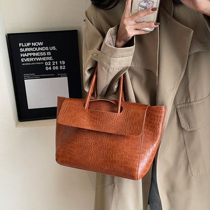 New stone pattern large capacity handbag in a textured design; brand not visible