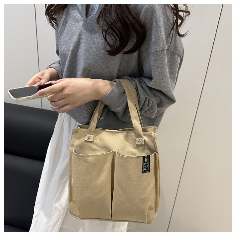 Plain-colored tote bag student lunch box in a simple solid-color design
