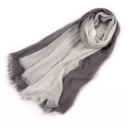 Large soft warm cotton scarf with tassel-trimmed edges, displayed flat