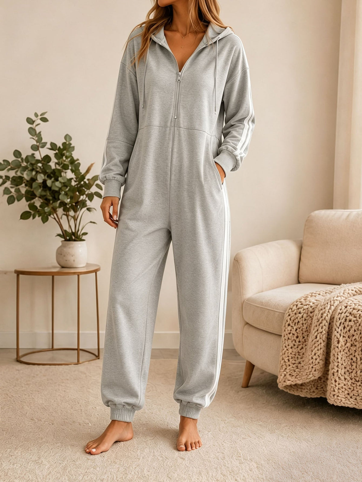 Women's loose-fitting hooded zip-up jumpsuit in a casual full-body style