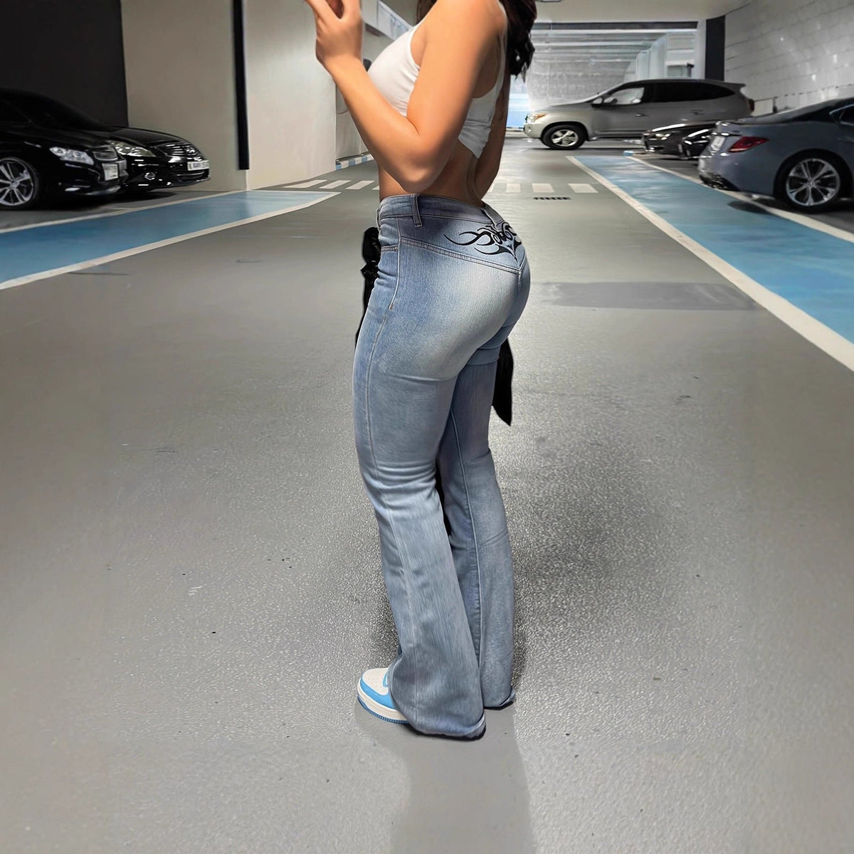 Slim-fit denim jeans with retro hip-hop street-style print񎟂