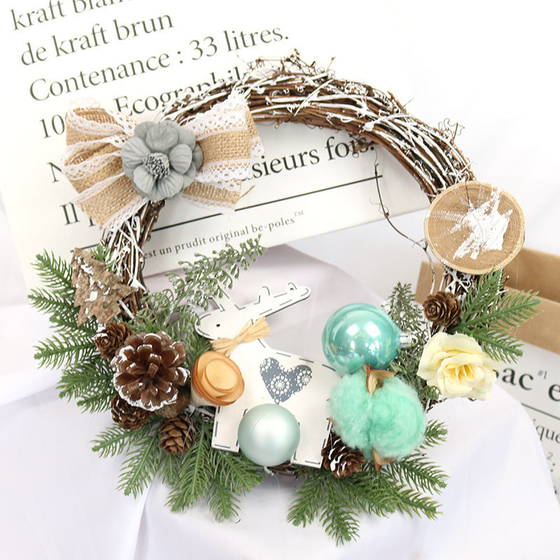 Christmas garland window decoration with festive greenery and holiday ornaments hanging in a window