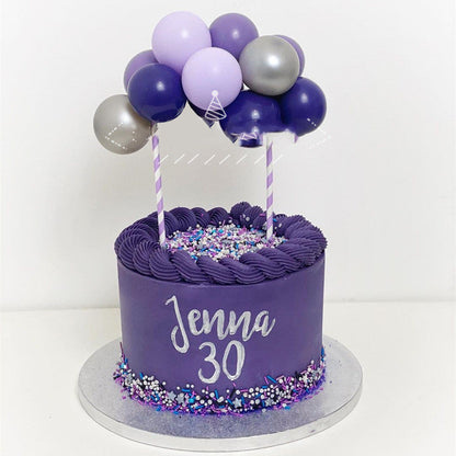 Red 5-inch sequined balloon cake decoration on a net holder for party desserts