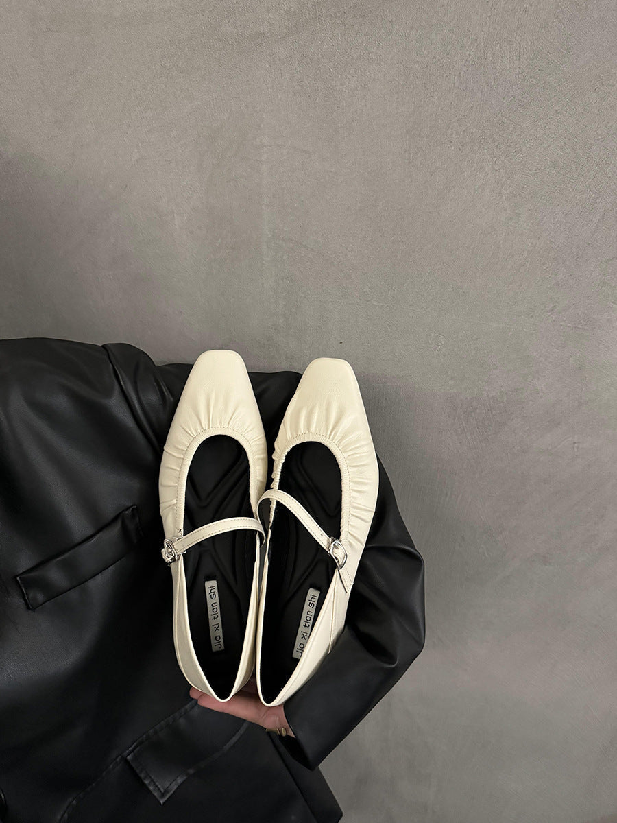 Women's silver flat dress shoes, elegant low-profile footwear displayed against a plain background