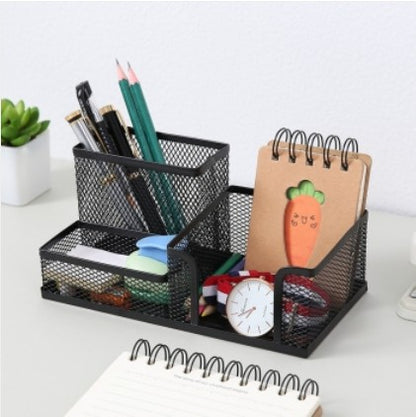 Creative metal four-grid pen holder for office use by BACKUPMYFILESNOW.COM® with organized compartments for stationery.