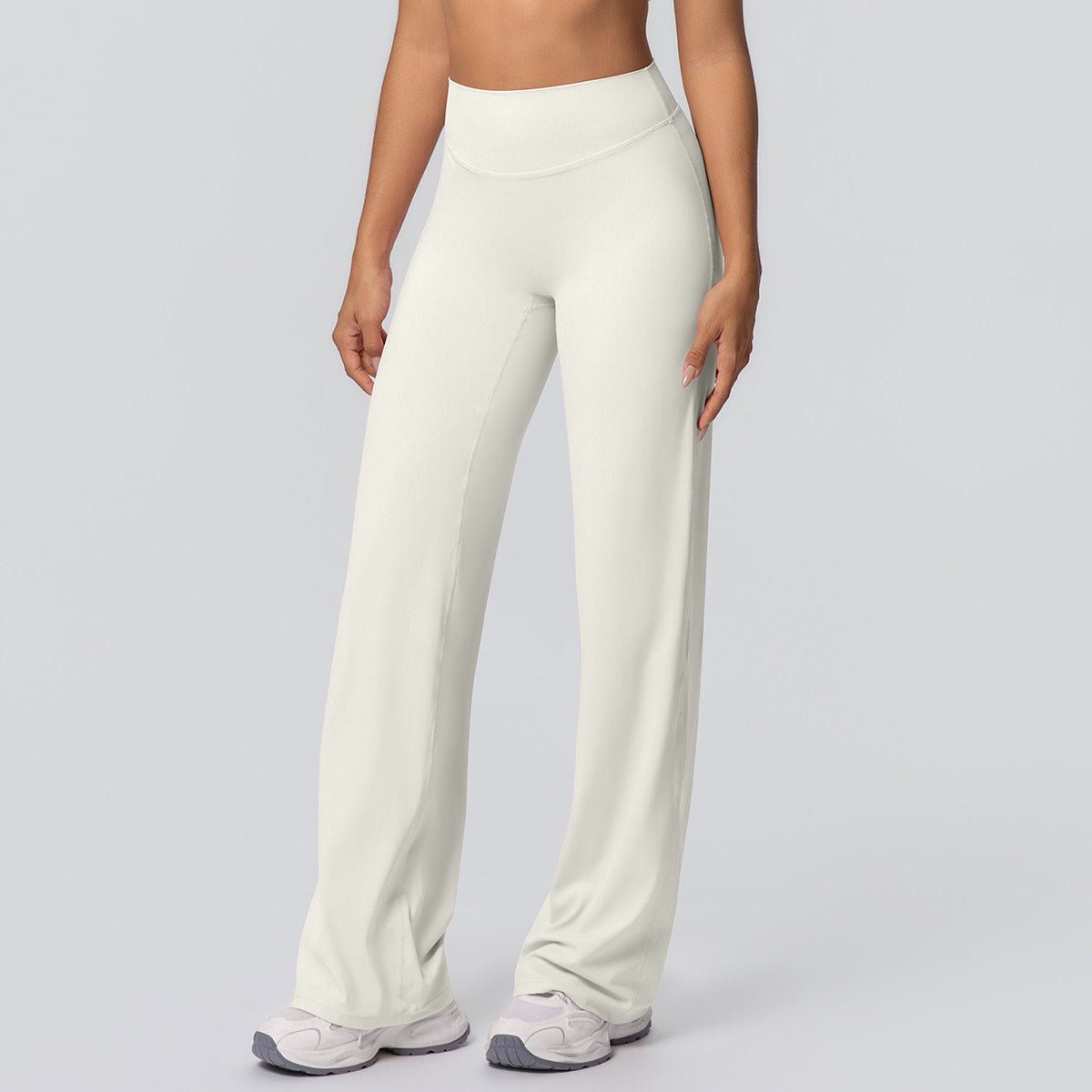 Casual high-waisted loose-fit solid-color yoga pants with a hip-hugging design, shown on a model