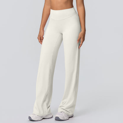 Casual high-waisted loose-fit solid-color yoga pants with a hip-hugging design, shown on a model