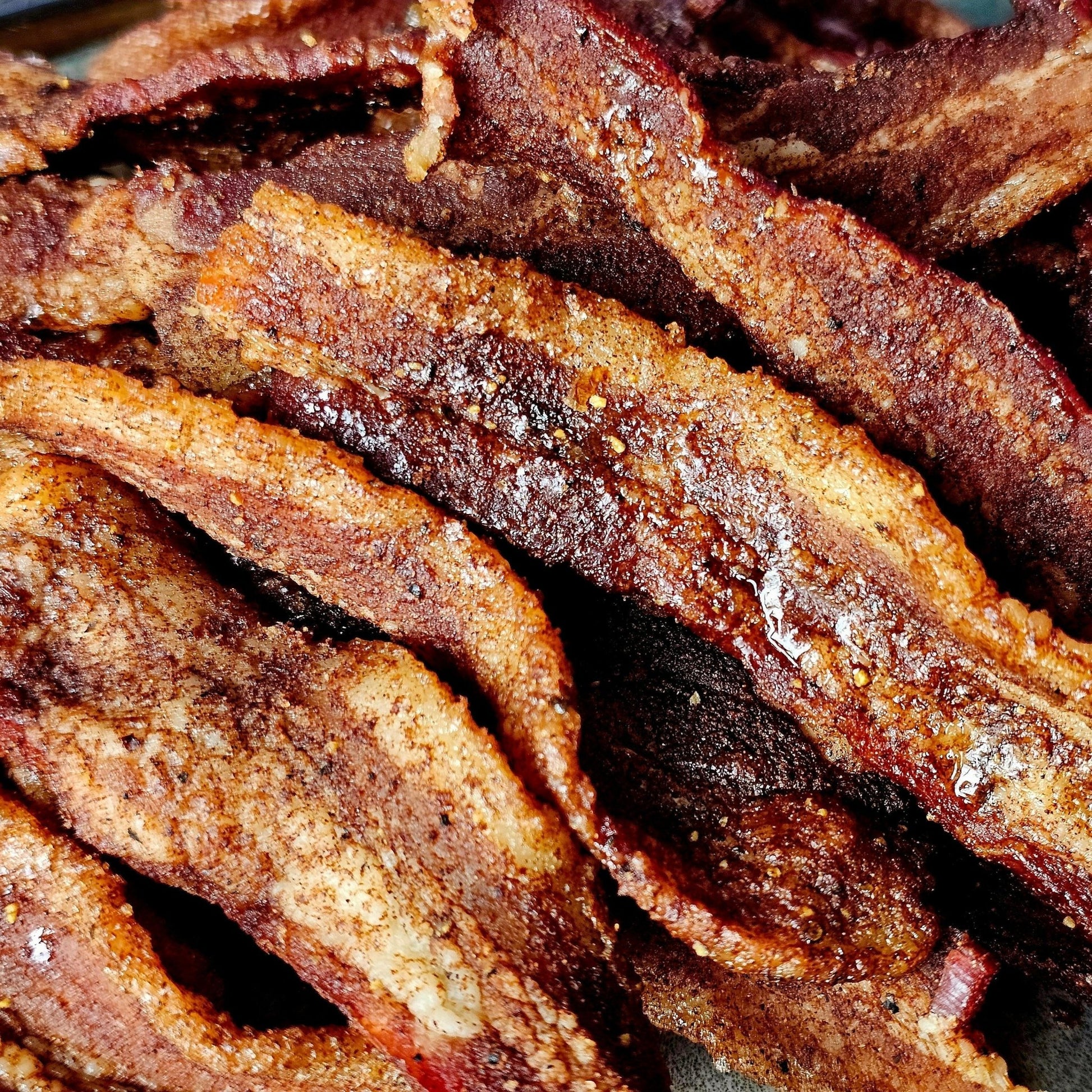 Cedar Valley Cuts Brown Sugar Cinnamon Bacon Jerky, 2oz snack-sized premium bacon jerky with sweet and savory flavor.