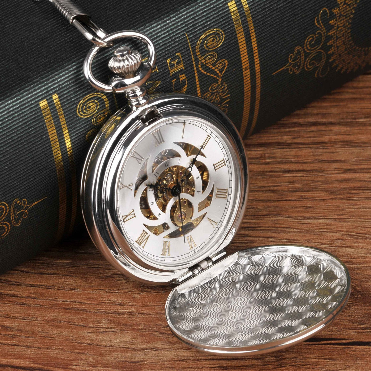 Large silver double-hinged mechanical pocket watch with visible cover and classic design