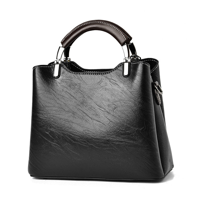 Simple retro small handbag for women, compact structured design in a classic style
