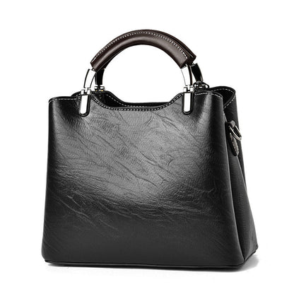 Simple retro small handbag for women, compact structured design in a classic style