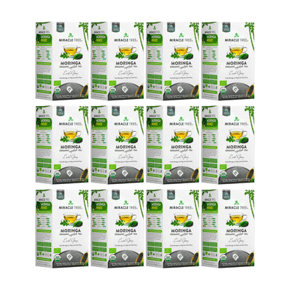 Organic Moringa Earl Grey herbal tea by Miracle Tree, featuring dried tea leaves and herbs in a clear tea cup.