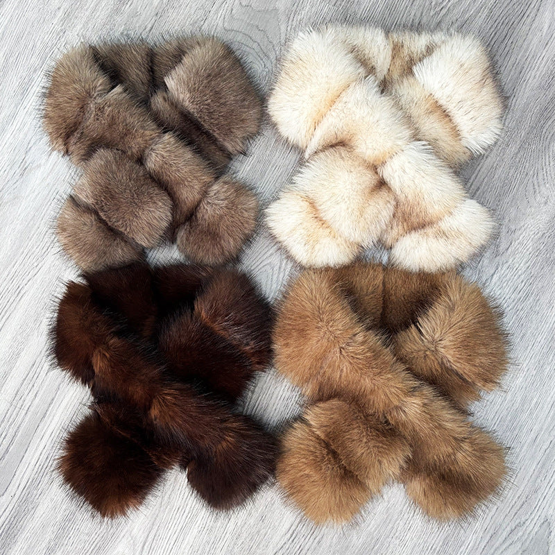 Segmented wool patches and plush materials cross-knitted into a mature, elegant coat with fur detailing