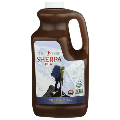 Bottle of Sherpa Chai Chai Concentrate by Nepal Tea, showcasing the beverage in a clear container with a label and cap.