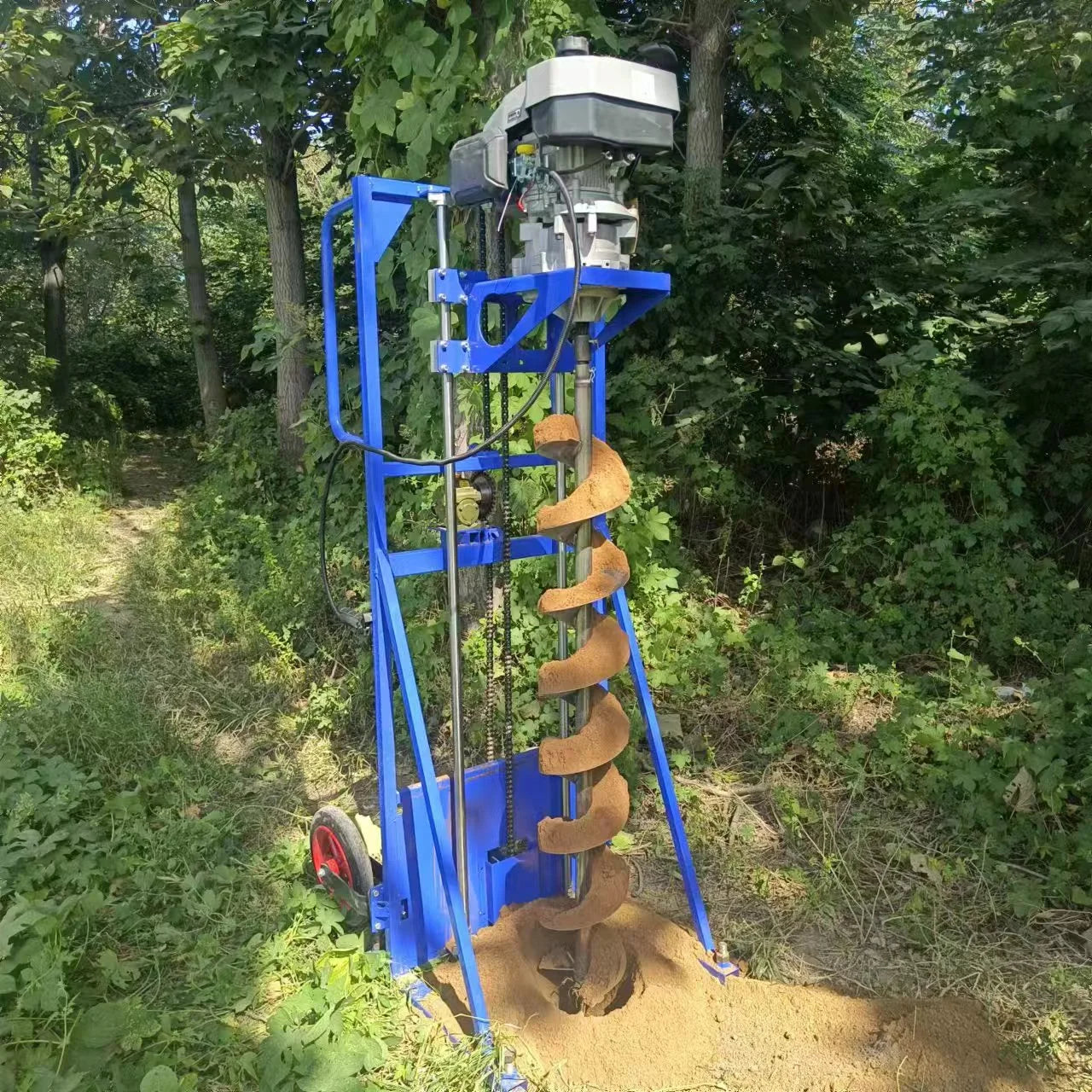 Changsha Zhenpian ground hole earth auger drill for well digging and soil excavation, featuring a sturdy digging machine and auger bit.