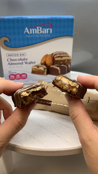 Close-up of AmBari Nutrition chocolate almond wafer bar, showing layered chocolate and almond filling with a crispy wafer exterior.