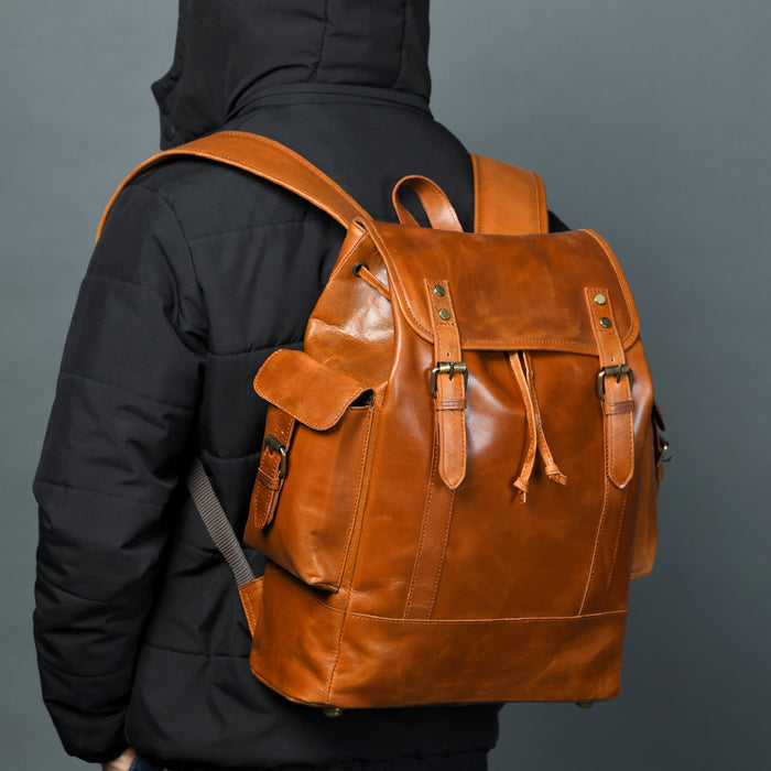 Earthen Leather Laptop Backpack by Classy Leather Bags, showing a stylish brown leather backpack with multiple compartments and adjustable straps.