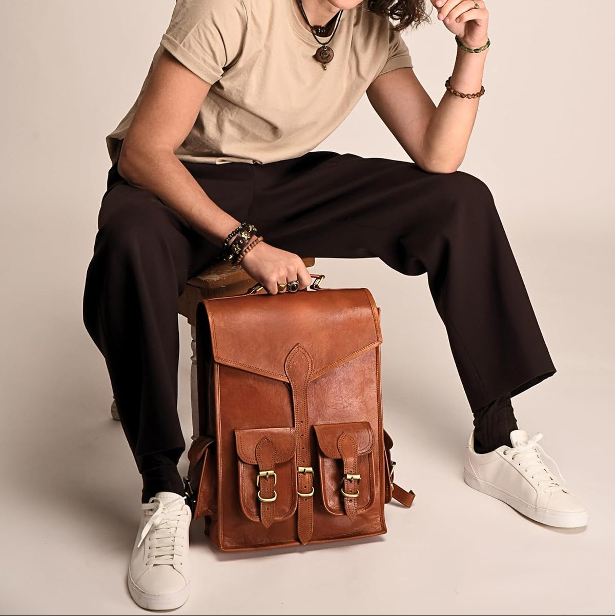 Vintage leather backpack rucksack by Classy Leather Bags, showing its classic brown leather design with adjustable straps.