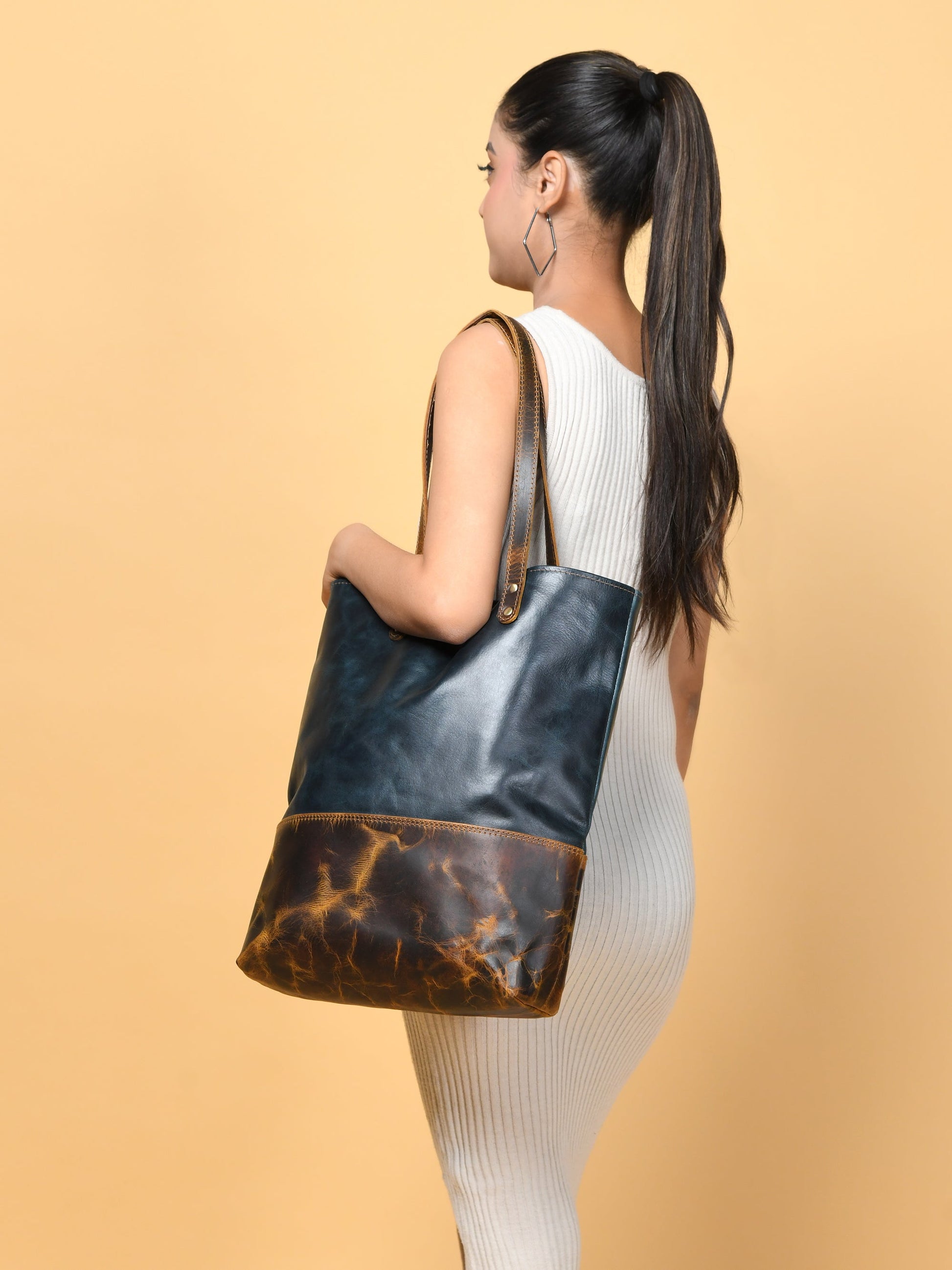 Blue women's leather tote by Classy Leather Bags, stylish leather handbag with sturdy handles and spacious interior.