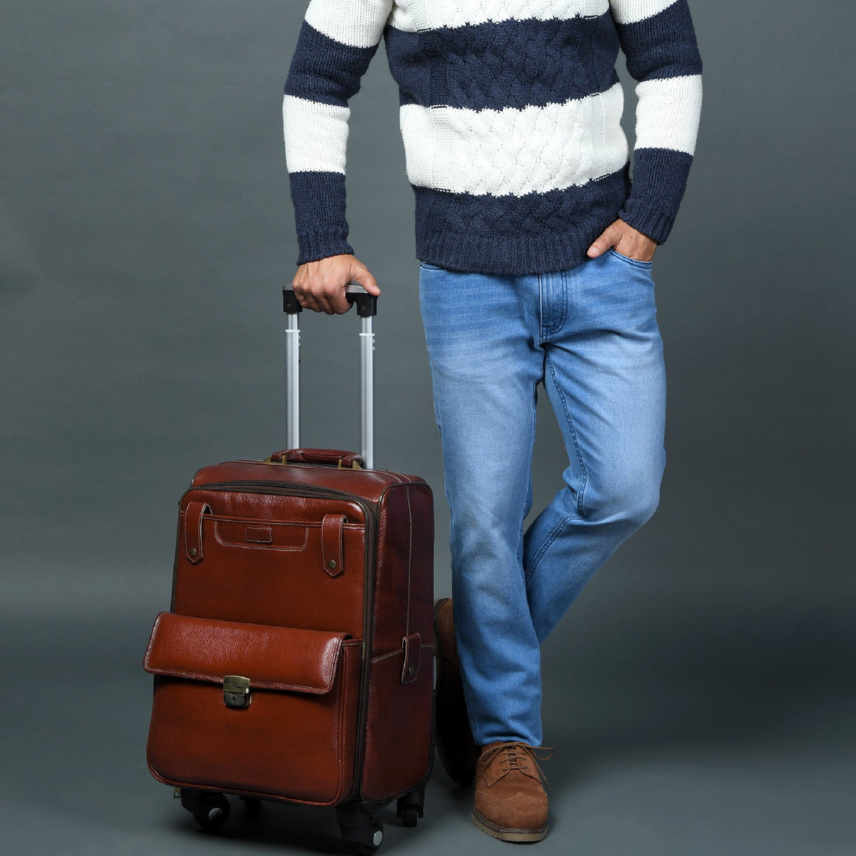 Leather carry-on trolley bag by Classy Leather Bags with durable leather exterior and adjustable handle for travel.