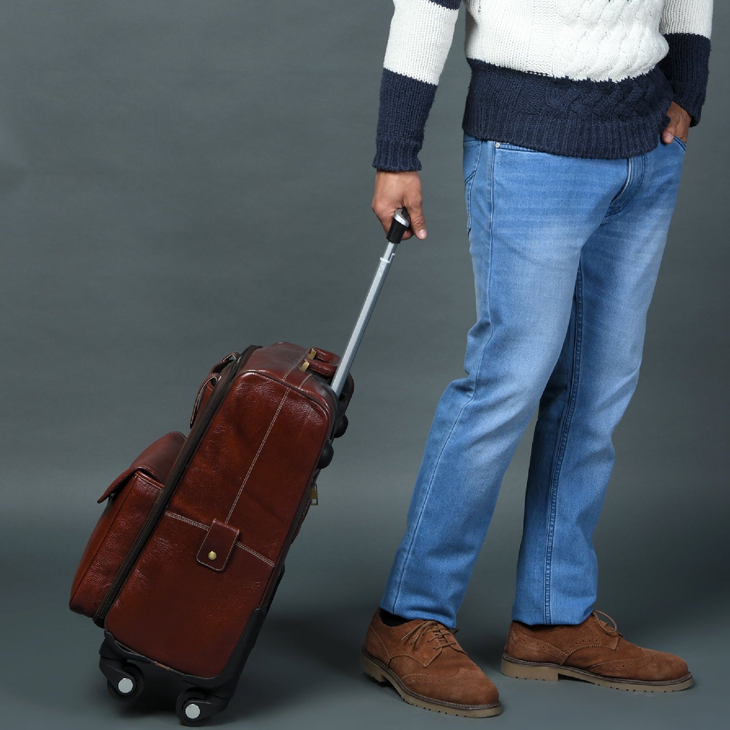 Leather trolley bag by Classy Leather Bags with sturdy handles and wheels, perfect for travel and carrying essentials.