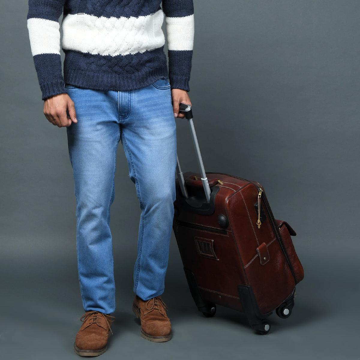 Leather carry-on trolley bag by Classy Leather Bags with sturdy handles and spacious interior for travel.