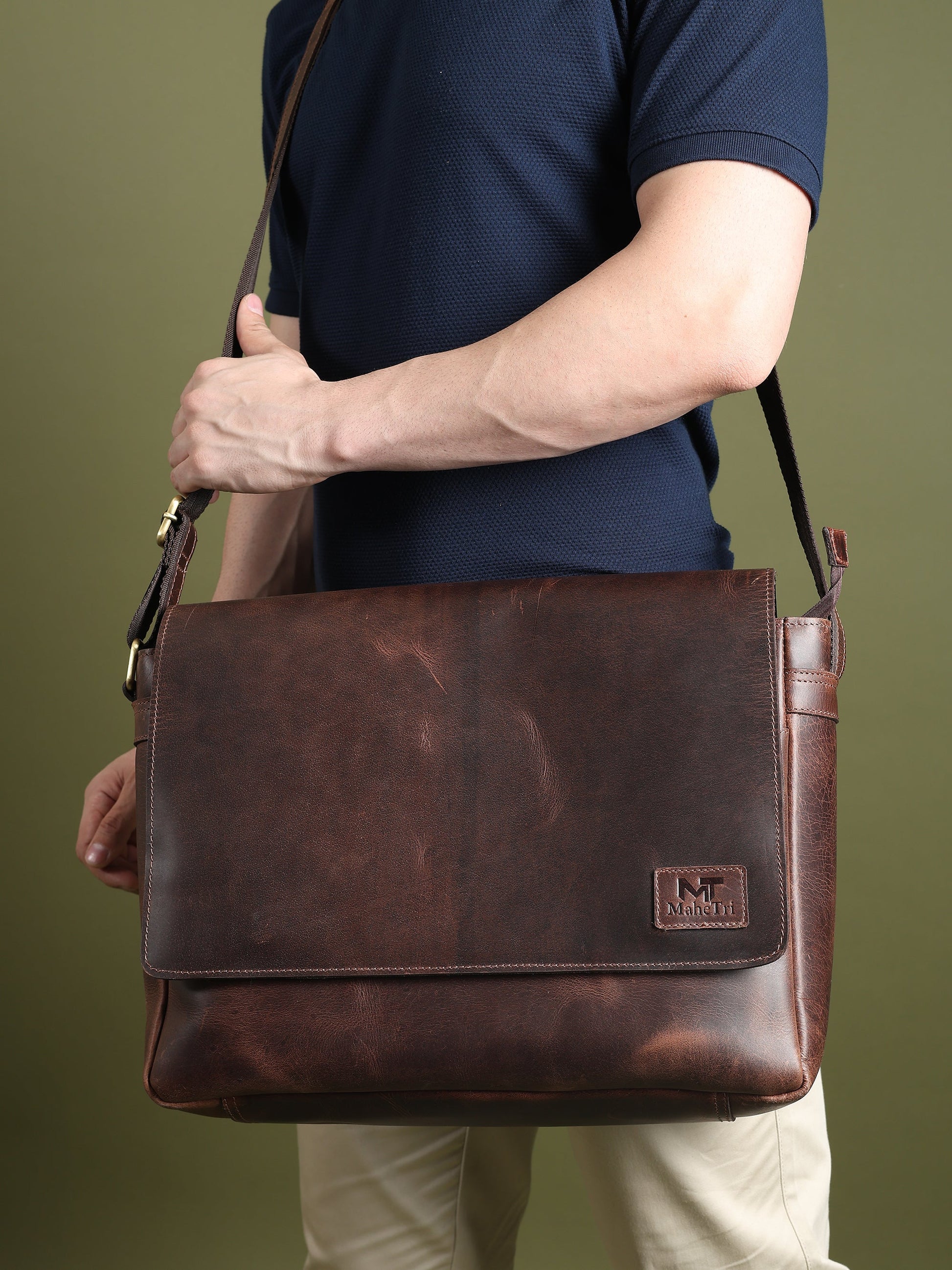 Genuine Sitka leather messenger bag from Classy Leather Bags, featuring a sleek design with a sturdy handle and adjustable shoulder strap.