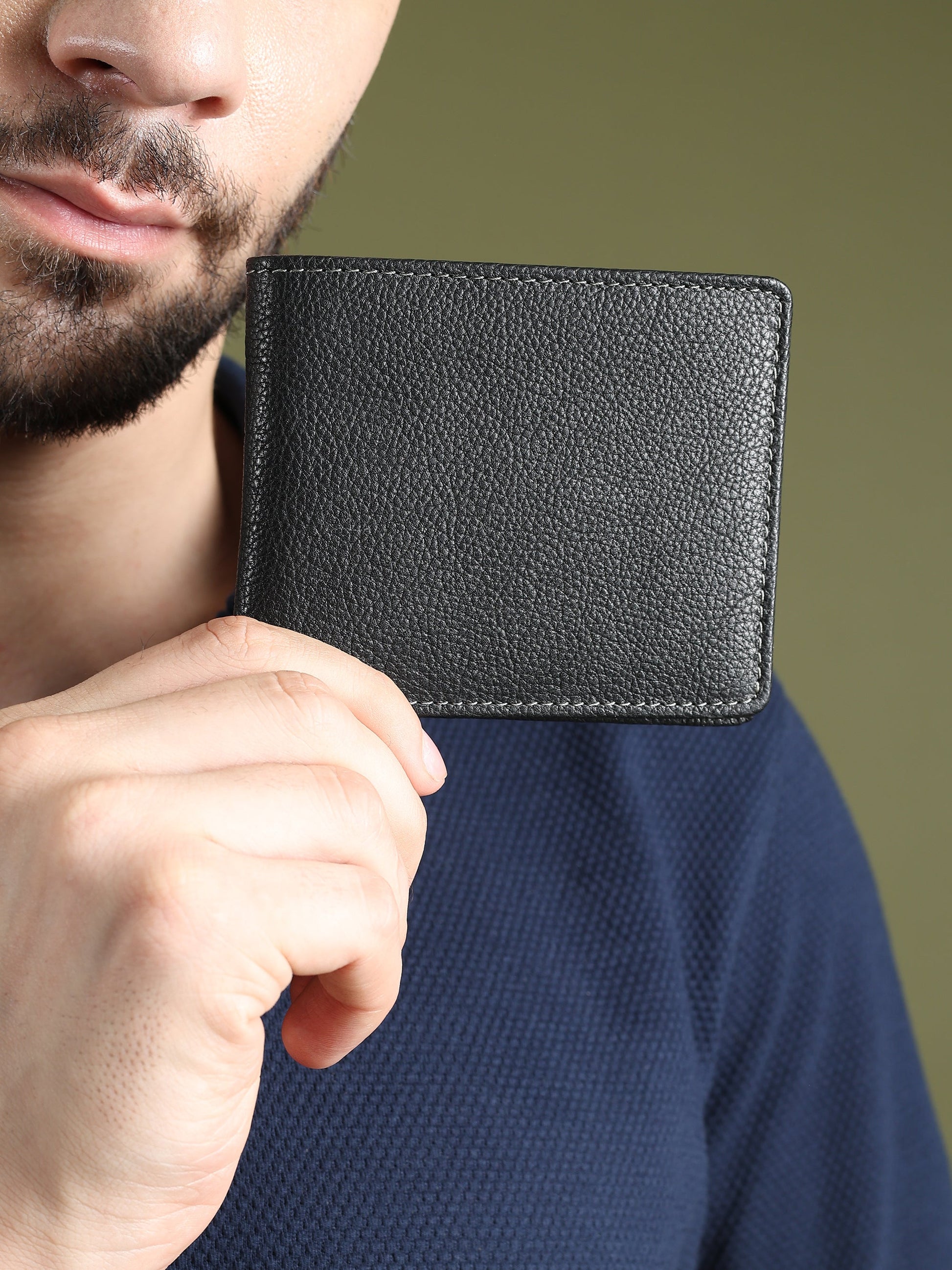 Black textured leather men's wallet from Classy Leather Bags, showcasing a sleek, durable design with multiple card slots.
