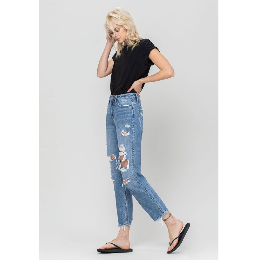 Light-wash distressed mom jeans from ClaudiaG, featuring casual fit, rips, and frayed hems, styled as trendy casual bottoms.