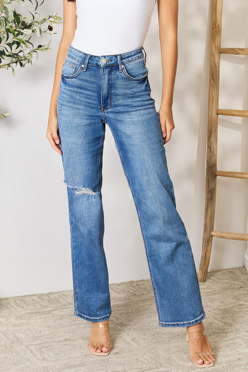 ClaudiaG high waist distressed jeans for women, featuring a fitted design and ripped details, shown on a model.