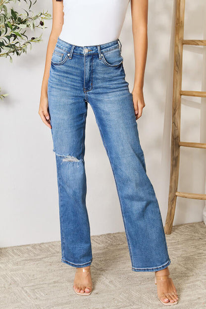 ClaudiaG high waist distressed jeans for women, featuring a fitted design and ripped details, shown on a model.