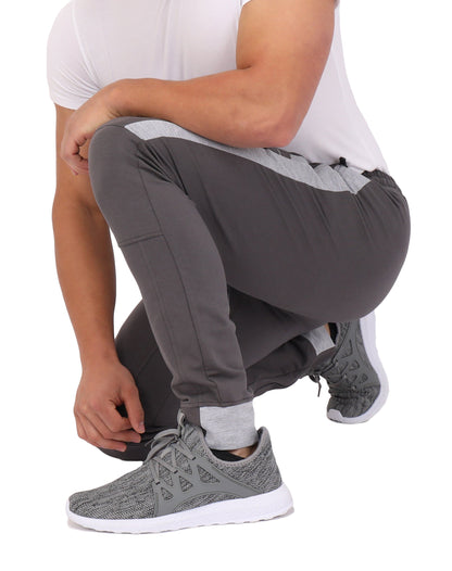 Close-up of SCR Sportswear Infinite Flex Tall Fit men's joggers sweatpants showing fabric texture and relaxed fit details.
