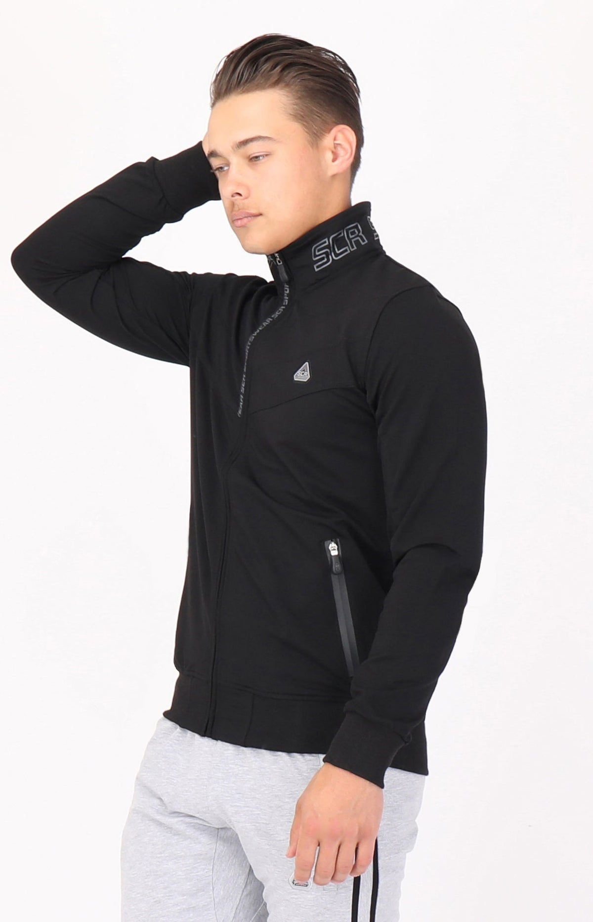 Closeup of SCR Sportswear men's All-Day Comfort full-zip sweatshirt, athletic-casual bomber jacket with a front zipper and soft fabric.