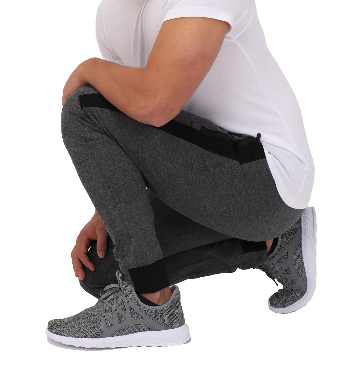 Closeup of SCR Sportswear Infinite Flex Tall Fit men's joggers sweatpants showing soft fabric and tapered fit.