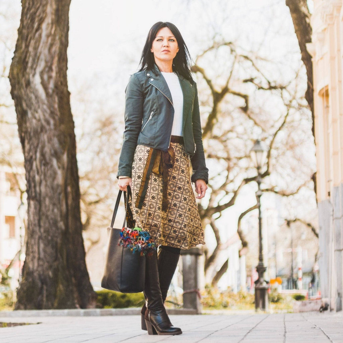 Knee-length mini sari wrap skirt by Darn Good Yarn in warm tones, featuring traditional fabric and stylish, flowing design.
