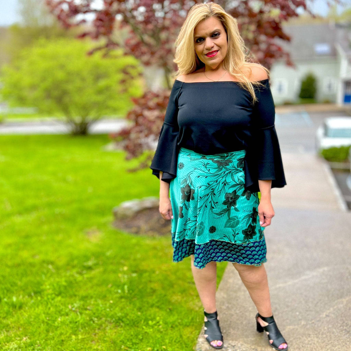 Knee-length mini sari wrap skirt in warm tones by Darn Good Yarn, featuring colorful, traditional fabric and stylish design.