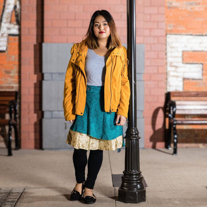 Knee-length mini sari wrap skirt in warm tones by Darn Good Yarn, featuring vibrant, colorful traditional clothing and accessories.
