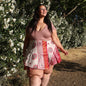 Knee-length mini sari wrap skirt by Darn Good Yarn in warm tones, featuring vibrant fabric and traditional design.