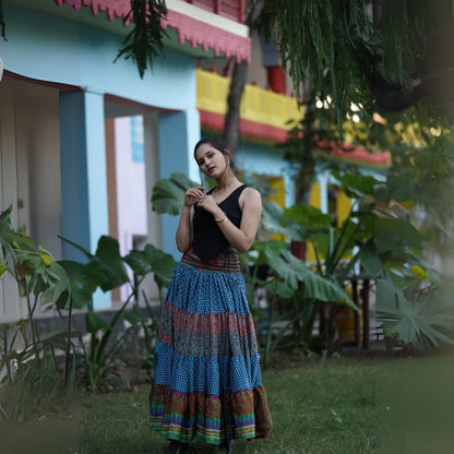 Darn Good Yarn Woodstock Dreams Fiesta Sunset skirt in vibrant, boho-style with colorful patterns and flowing fabric.