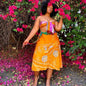 Darn Good Yarn Made With Love sari wrap skirt in vibrant fabric, styled as a versatile clothing and accessories piece.