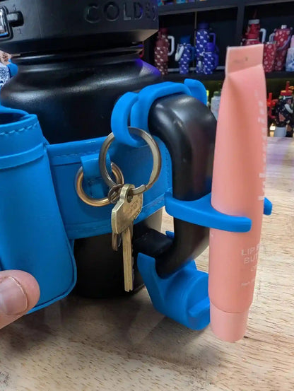 Coldest mini backpack and squeeze holder with key hanger and mint box, in black, compact and functional for everyday use.
