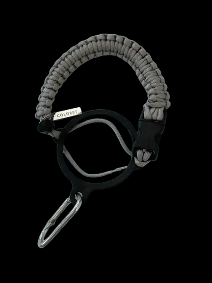 Coldest Paracord Handle accessory with black and orange paracord wrapping and metal attachment for durable outdoor use.