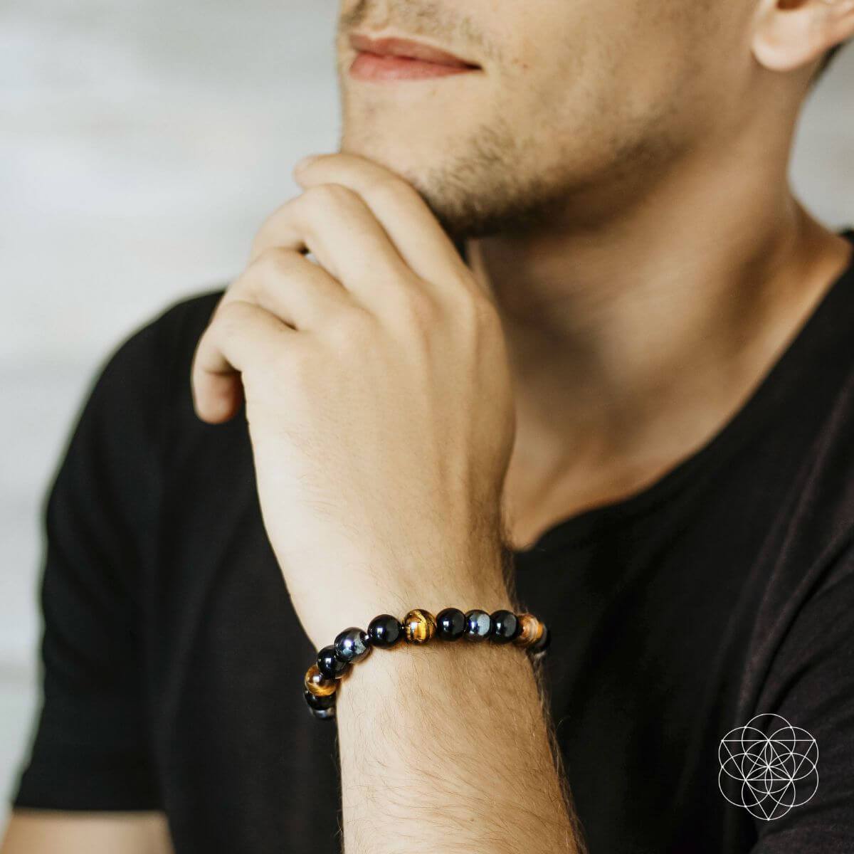 Conscious Items Triple Protection Bracelet featuring layered design with beads and charms on a neutral background.