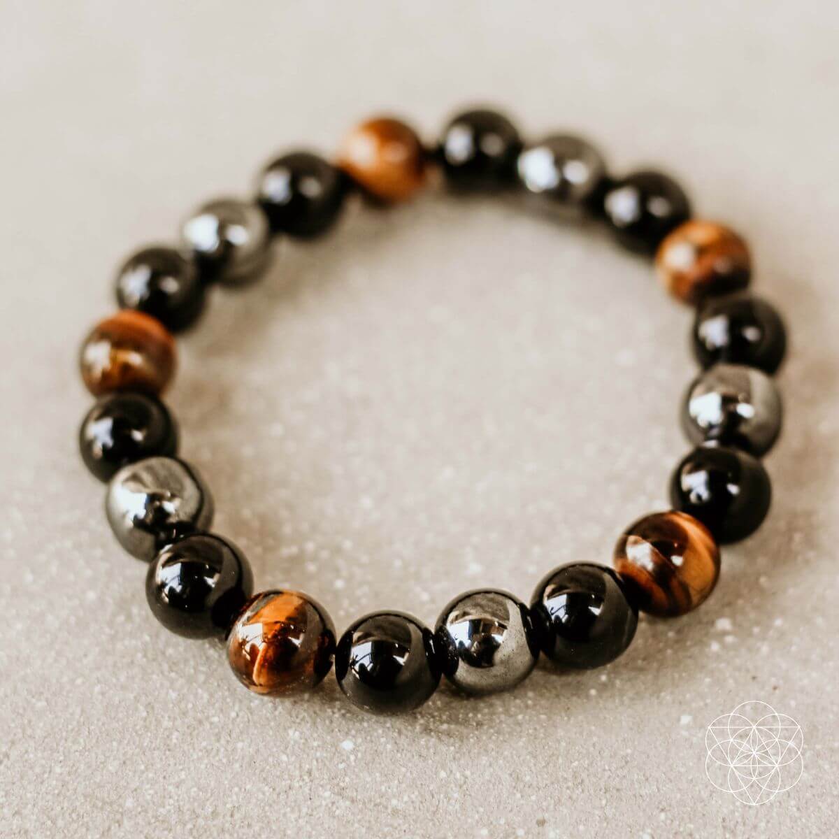 Conscious Items Triple Protection Bracelet featuring natural stones and a sleek design for spiritual protection and style.