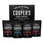 Cooper's Cask Coffee gourmet coffee sampler gift box with four ground coffee bags: Sumatra Dark, Kenya AA Medium-Dark, Rwanda Medium, Ethiopian Light.