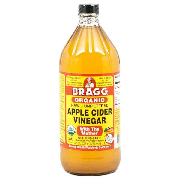 Organic apple cider vinegar from Country Life Natural Foods in a 32 oz bottle, showing the clear, amber-colored liquid inside