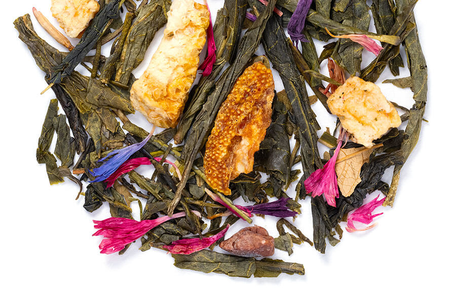 Loose leaf Cranberry Nut Muffin tea by Novel Tea Book Shop, showing green tea leaves with cranberry and nut pieces.