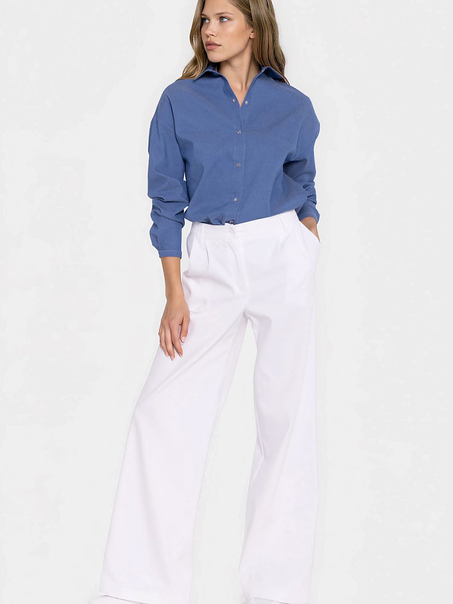 Nife Jeans model 228924, classic blue pants with a slim fit style, shown on a hanger against a neutral background.