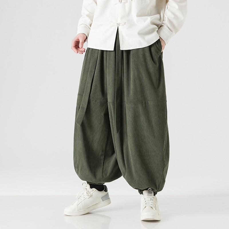 Men's loose-fitting harem pants with elastic cuffs, front and back view